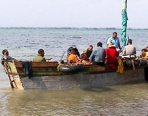 Cuban refugees repair boat in Frank Sound
