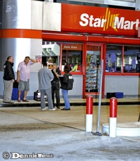 Gas station robbers fire gun