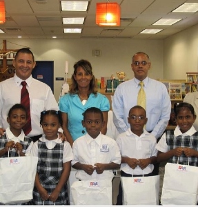 Politicians donate school bags for kids in need